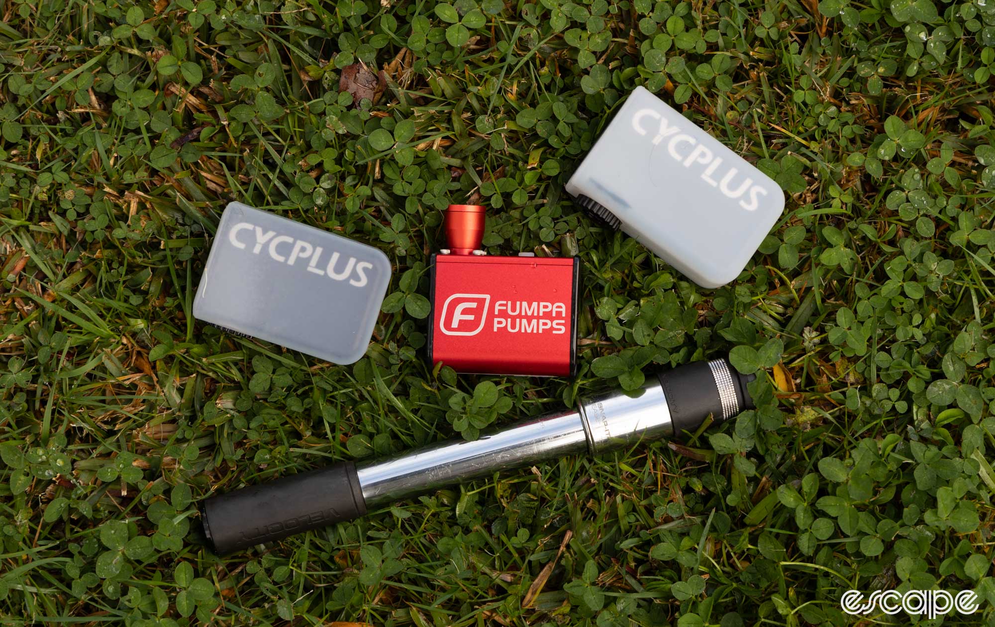 Mini electric inflators and a mini pump on grass